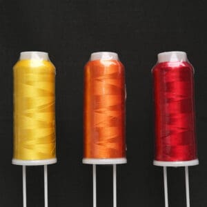 Machine Borduur Garen 3000 Yards in de kleuren Geel, Oranje en Rood. 6 stuks per doos.